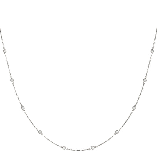 1.00CT diamond station necklace in white gold with round bezel-set diamonds evenly spaced along a delicate chain for a floating effect.