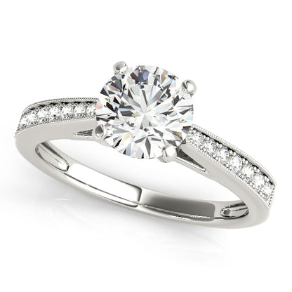 Channel-set engagement ring featuring 1CT Round Lab Diamond with 14 pavé side diamonds and milgrain band crafted in 14K White Gold